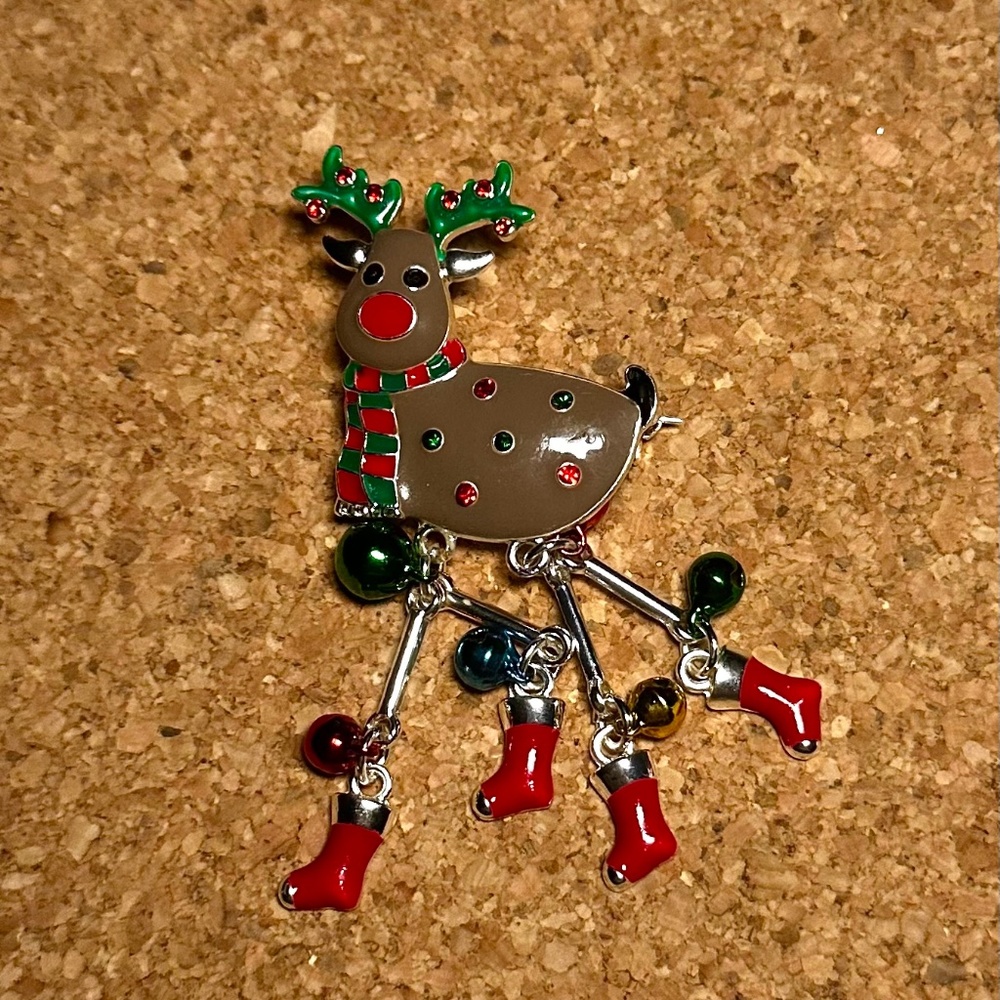 Dangling reindeer brooches